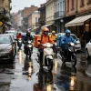 Lightweight rainproof workwear for Tbilisi delivery riders riding scooters on a rainy city street