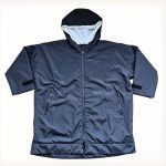 Front view of a navy Leapy waterproof windproof hooded changing robe with Sherpa lining and zip pockets