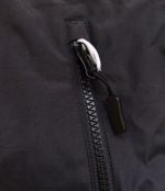 Close-up of the black zipper pull on a Leapy waterproof changing robe