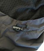 Close-up of the adjustable cord lock on a Leapy windproof changing robe