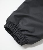 Close-up of the Leapy waterproof jacket's elasticated cuff, featuring a gathered design to seal out wind and retain warmth, with smooth, durable fabric texture suitable for cold-weather outdoor protection.