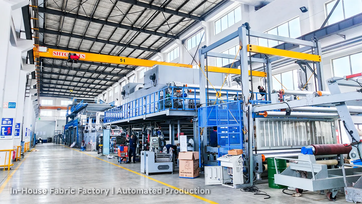 LEAPY in-house fabric factory with automated textile machinery for large-scale workwear material manufacturing.