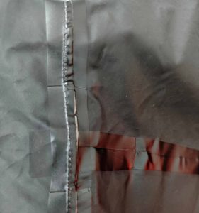 LEAPY heat-sealed waterproof seam tape and patch reinforcement inside workwear jacket seams.