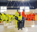 Leapy showroom displaying hi-vis safety vests and workwear on racks and mannequins.