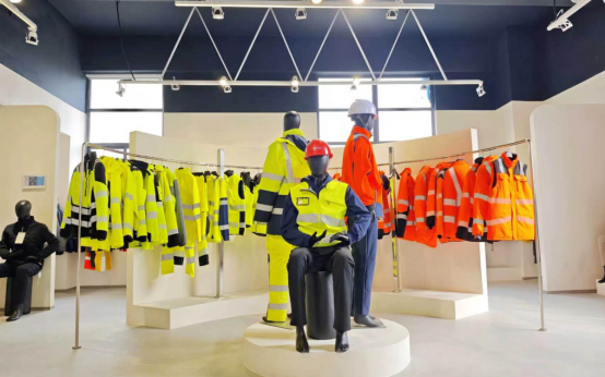 Leapy showroom displaying hi-vis safety vests and workwear on racks and mannequins.